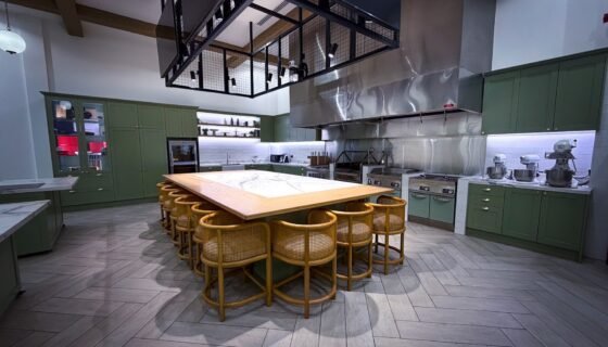 Chef JKP teaching kitchen with demonstration island and stools