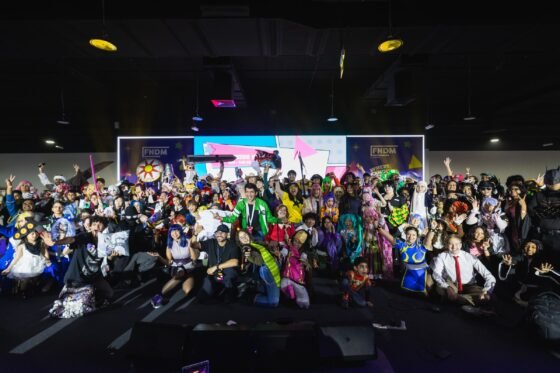 Cosplayers gather in front of the FNDM stage at a previous edition