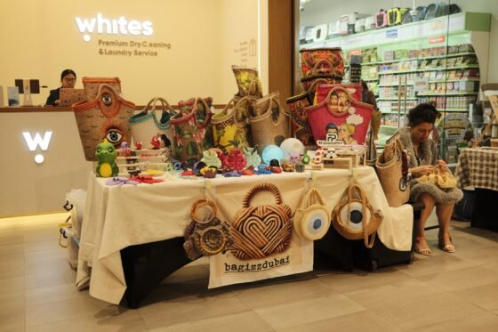 A MINT Market stall displays woven and decorated bags