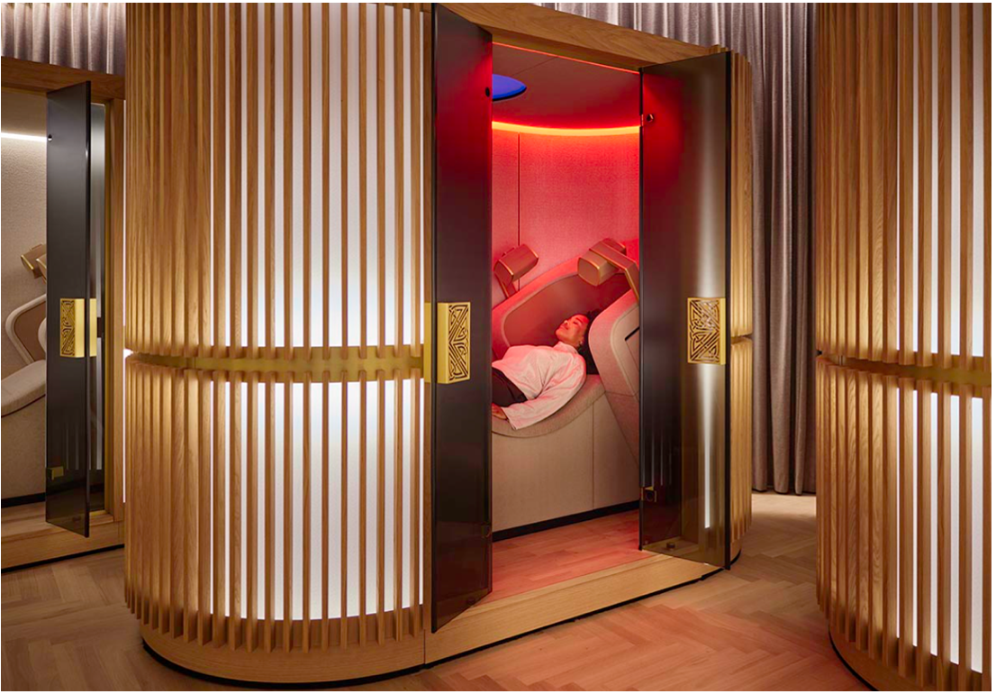 Guest reclining in a wood-screened Mind Oasis cocoon